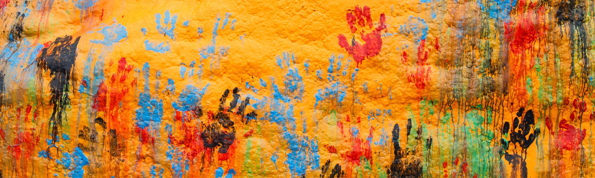 Multi-colored handprints on the Rock